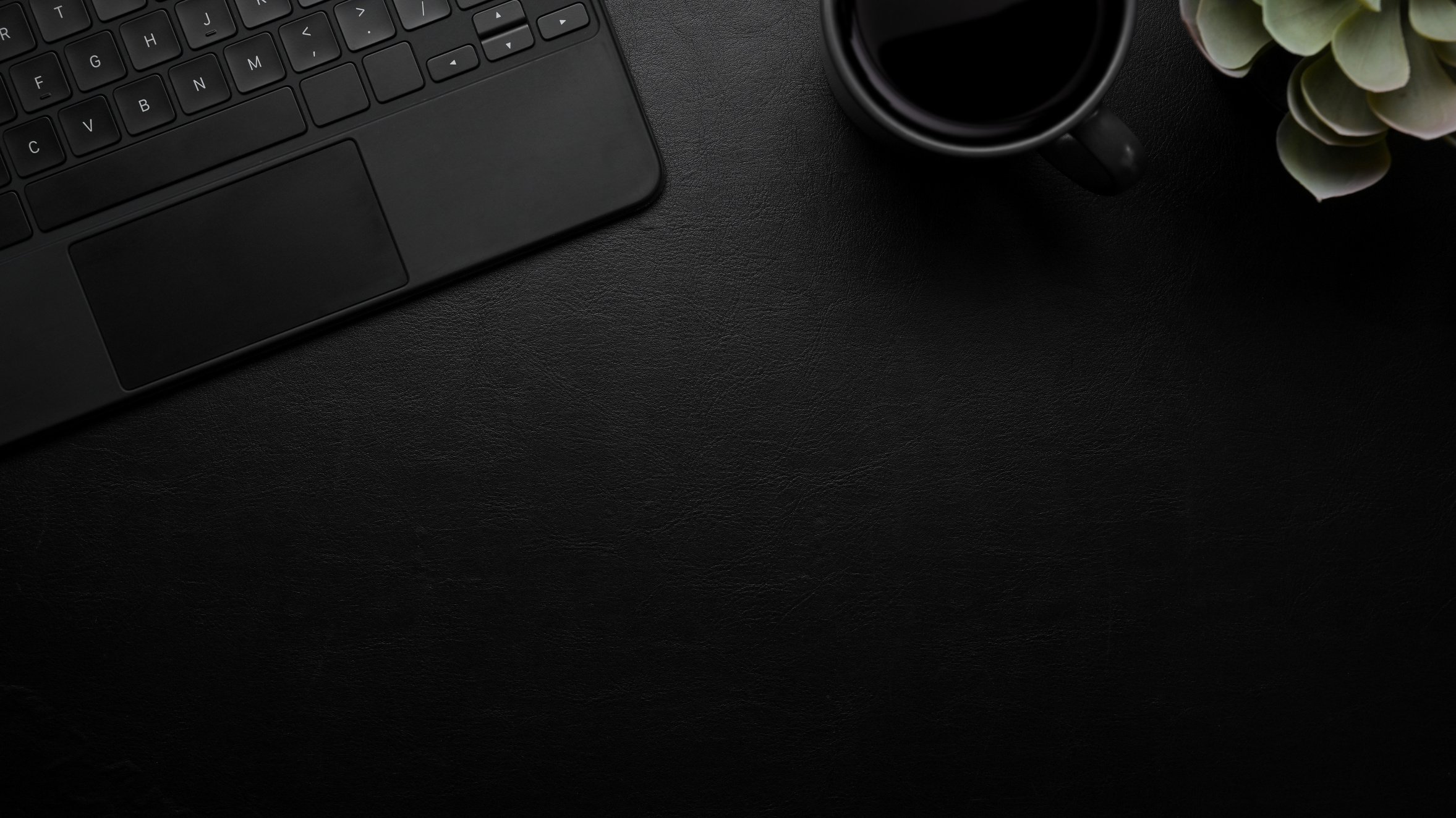 Modern dark leather desk with mockup place, keyboard, black